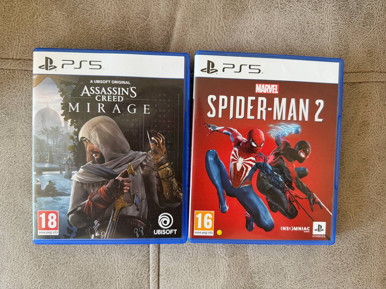 Две игры (Assassin's Creed + Spider-Man 2)
