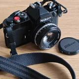 Плёночный фотоаппарат Nikon FM с объективом Nikkor AI-S 50mm F1.8 — reflex camera, lens cap (photo 2)