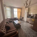 Квартира 2+1, 600$ — studio couch, home theater (photo 2)