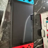 Nintendo Switch OLED Neon Blue/Red — moving van (photo 1)