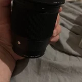 Объектив Sigma 16mm f/1.4 DC DN Contemporary для Sony E с фильтром — space heater, knee pad, reflex camera (photo 3)