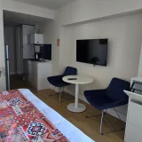 Студия в ЖК Орбити Сити — home theater, dining table (photo 3)