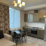 Квартира 1+1 — microwave, window shade, dining table (photo 1)