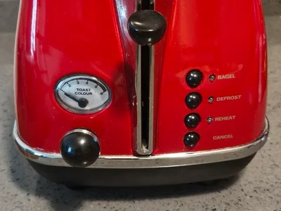Тостер Delonghi