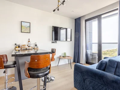 Large studio with sea and park view