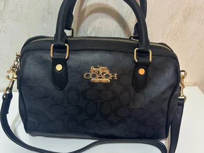 Сумка бочонок бренда Coach