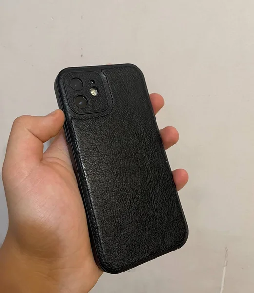 iPhone 12 64GB — cellular telephone, wallet, remote control