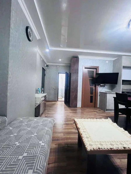 2-комнатная квартира 70 м2 — dining table, home theater, wardrobe