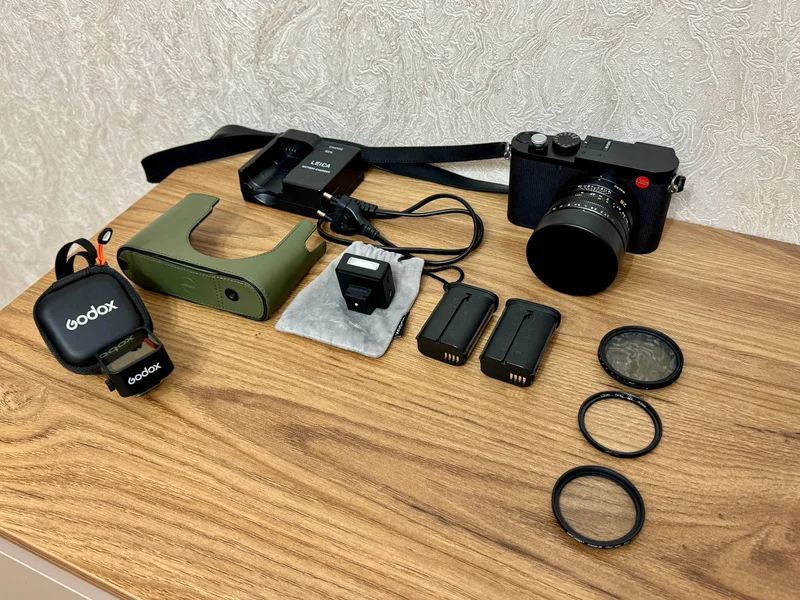 Leica Q3 — binoculars, revolver, holster