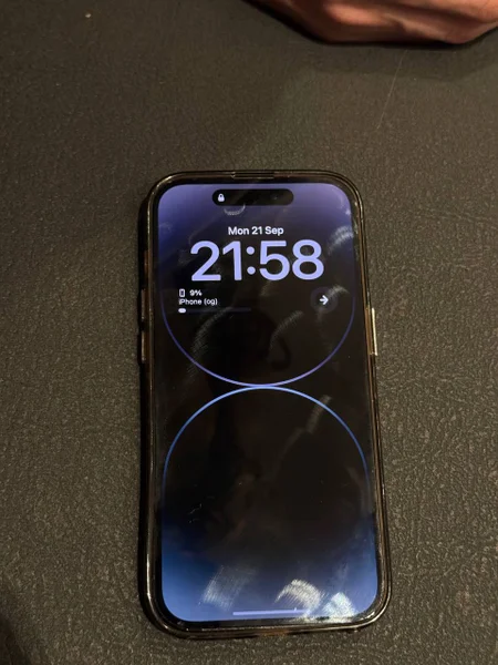 iPhone 14 Pro — cellular telephone, remote control, mouse