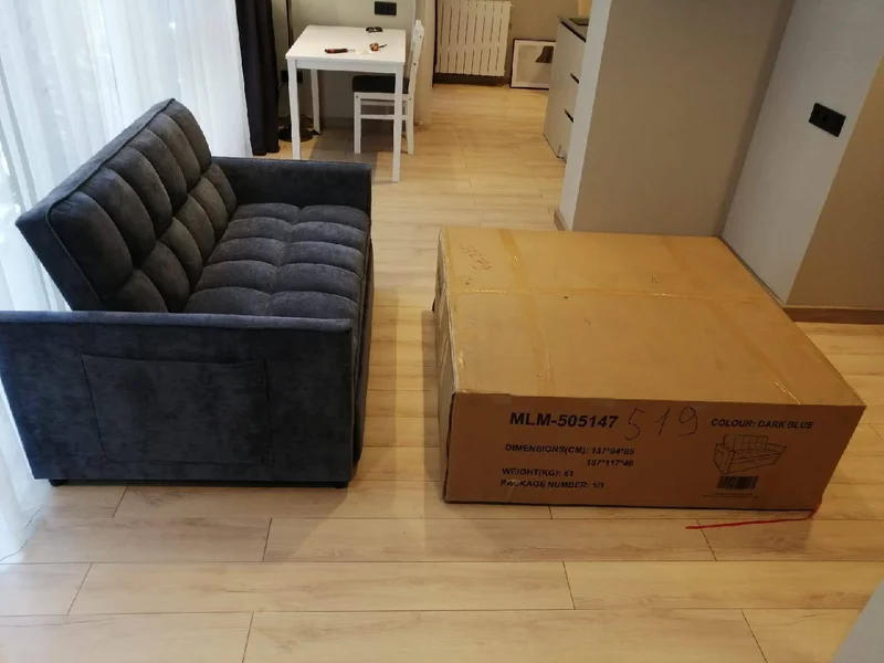 Новый диван в упаковке — carton, crate
