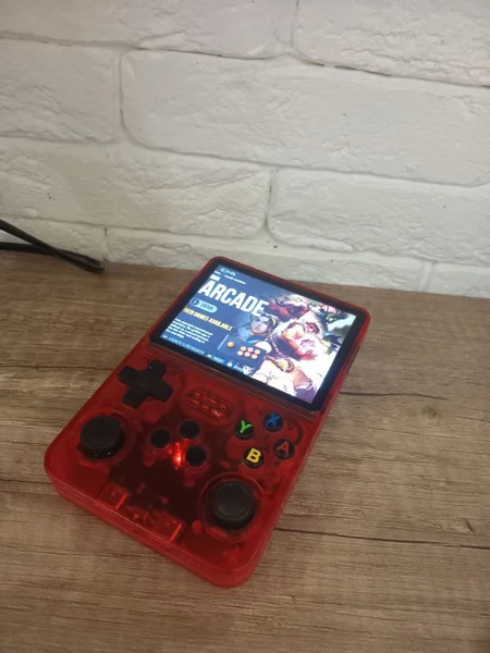 Портативная игровая консоль R36S — cellular telephone, remote control
