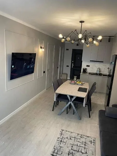 Квартира 2+1 на улице Агмашенебели, 2 — dining table, home theater, folding chair