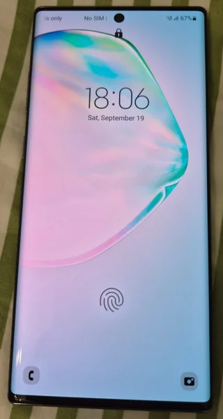 Samsung Galaxy Note 10+ 12/256GB — perfume, binder, book jacket